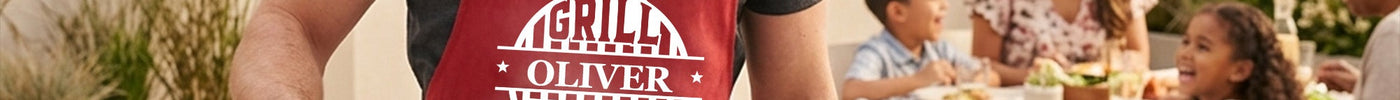 Personalized BBQ grill apron with custom embroidered name worn at the grill