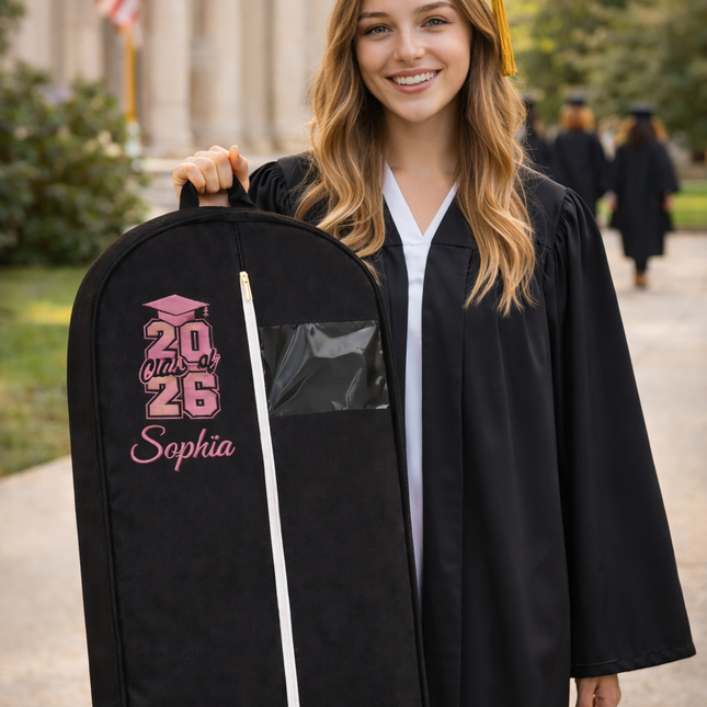 Graduate holding a personalized graduation gift bag outdoors.