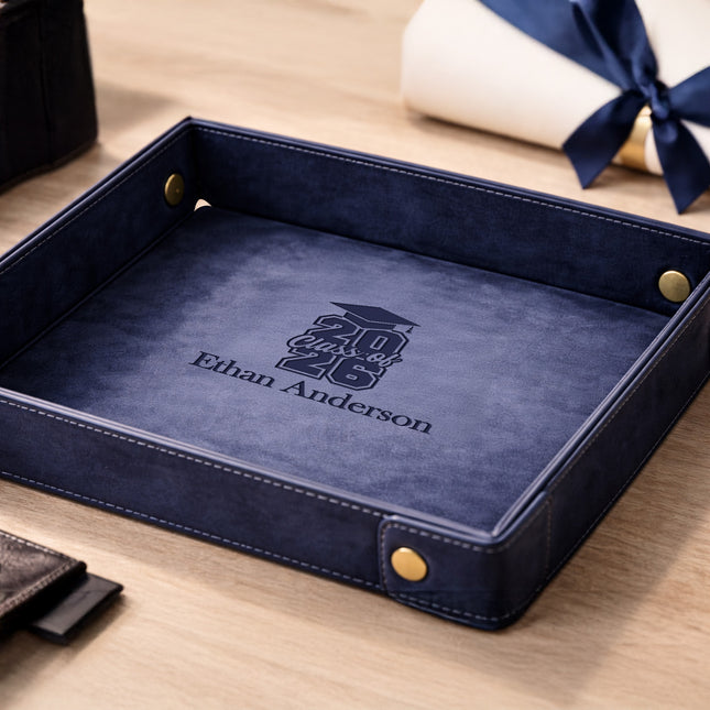 Blue leather tray with personalized engraving on a wooden surface