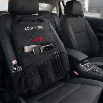 Black car seat organizer with multiple pockets and a visible brand logo in a car interior.