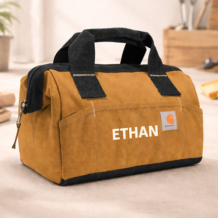 Brown tool bag with 'Ethan' branding on a light surface