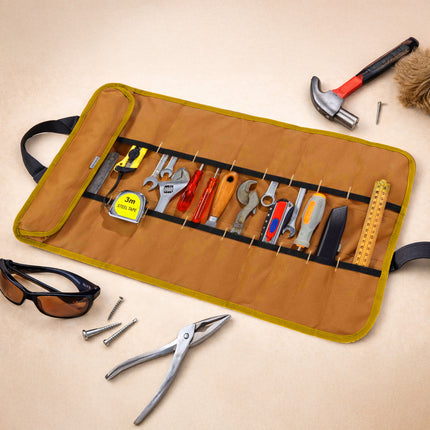 Set of tools in a roll-up organizer on a beige background