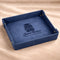 Blue tray with personalized design on a beige fabric background