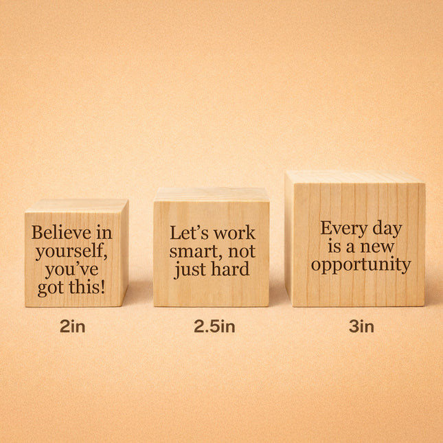 Three wooden blocks with motivational phrases on a beige background