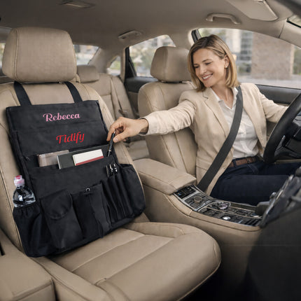 Woman in a car with a black car organizer bag on the back seat