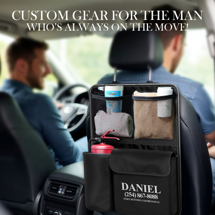 Car organizer with cleaning supplies and personalized name and contact information on a car interior background.