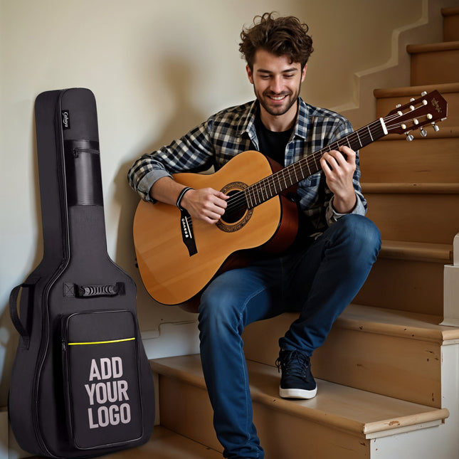 Man playing an acoustic guitar next to a guitar case with 'Add Your Logo' text on a staircase.