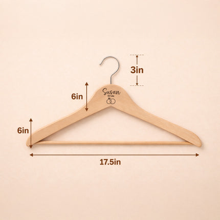 Wooden hanger with measurements on a beige background