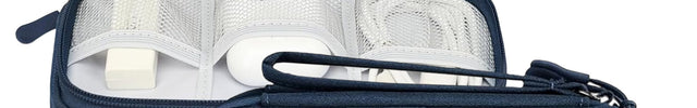 Navy blue travel case with 'Oliver' branding, containing electronic accessories.