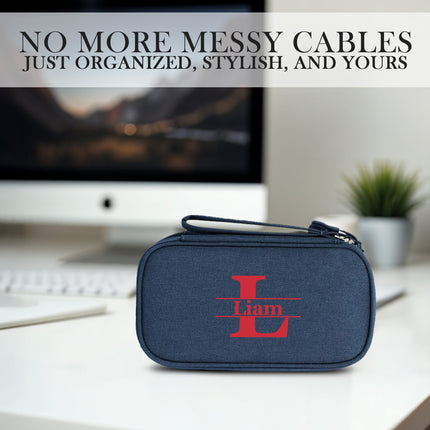 Blue cable organizer with 'Liam' logo on a desk with computer equipment in the background