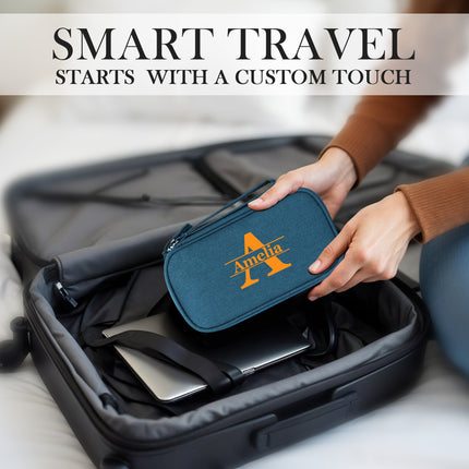 Person placing a blue travel pouch with 'Amha' logo into an open suitcase, with text 'Smart Travel Starts With A Custom Touch'.