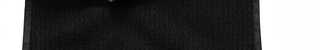 Black towel with red 'LUCAS' logo on a white background