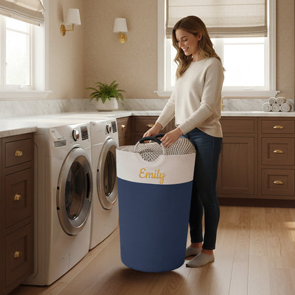 Woman in a laundry room with a blue and white laundry basket labeled 'Emily'.