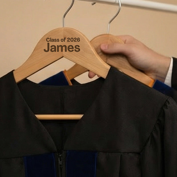 Graduation gown on a personalized hanger with 'Class of 2028 James' text.