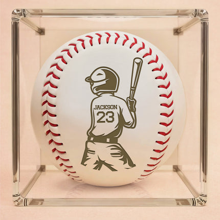 Baseball with a engraved silhouette of a batter and the name 'Jackson' and number '23' in a clear display case.
