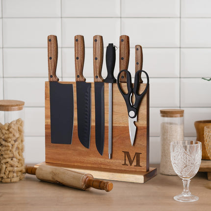 Wooden knife block set with knives and scissors on a white background
