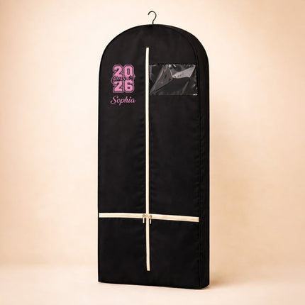 Black garment bag with pink text on a beige background