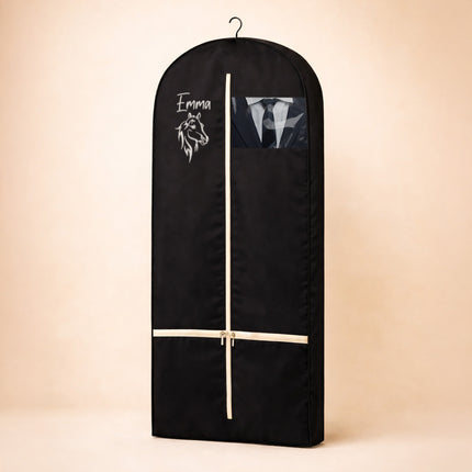 Black garment bag with a wooden rod on a beige background