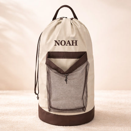 Drawstring bag with 'NOAH' branding on a beige background