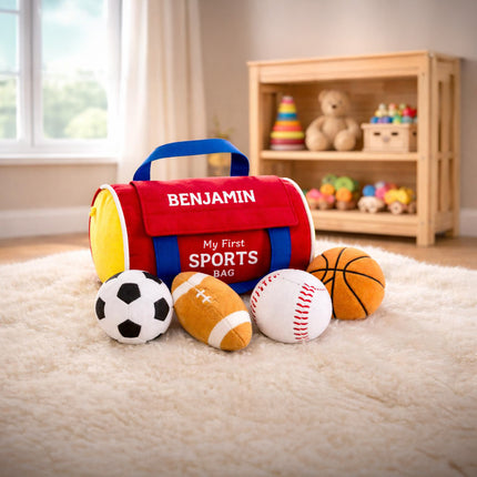 Children's toy sports bag with plush sports balls on a carpeted floor.