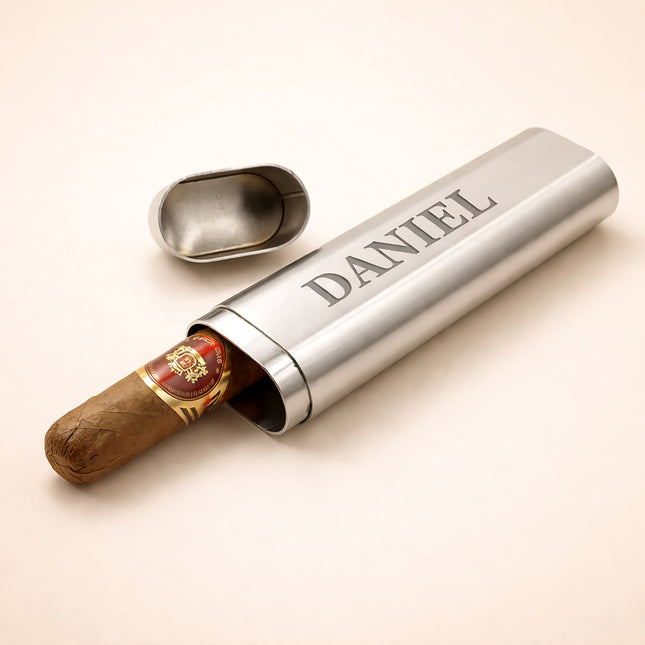 Cigar humidor with a cigar inside, branded 'DANIEL', on a light beige background