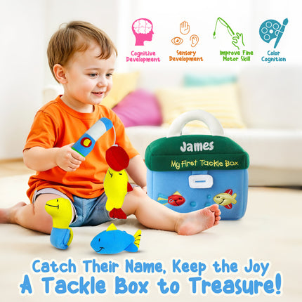 Child playing with a toy tackle box labeled 'James' on a light-colored floor.