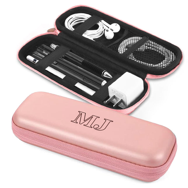 Pink case with black interior containing electronic accessories on a white background