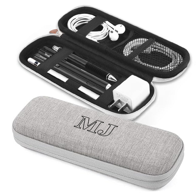 Gray carrying case with 'MJ' initials and open black case with electronic components on a white background