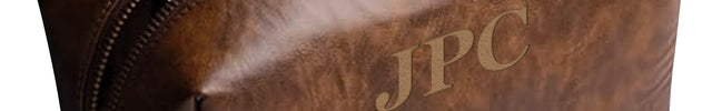 Brown leather pouch with 'JPC' branding and a phone inside on a white background