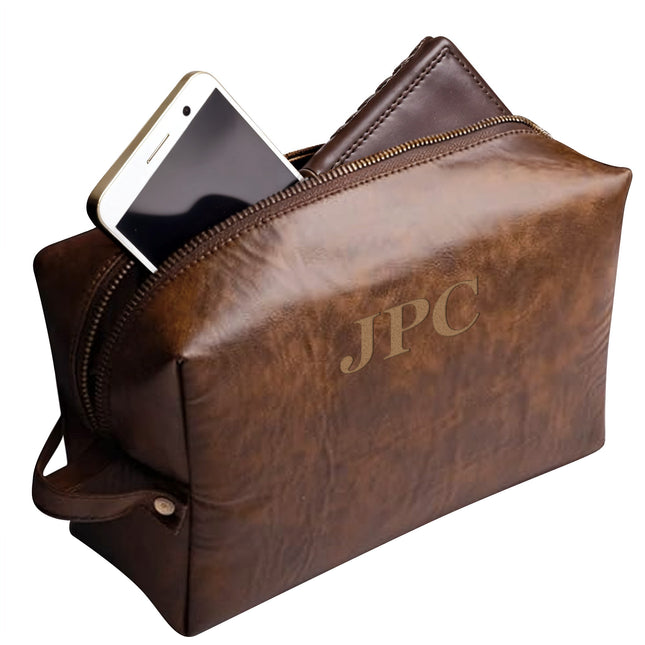 Brown leather pouch with 'JPC' branding and a phone inside on a white background