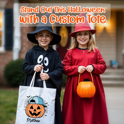 Two children in Halloween costumes holding a custom tote bag and pumpkin bucket.