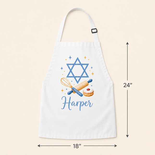 White personalized apron with a blue Star of David, rolling pin, whisk, and donut graphic, featuring the name Harper and dimension markers of 18 inches wide by 24 inches tall on a beige background.